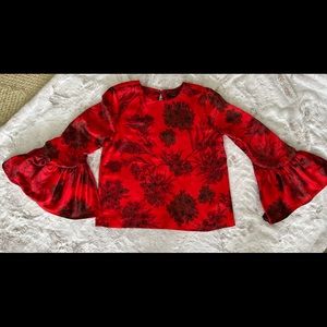 Marks & Spencer luxurious bell sleeved flower print top.